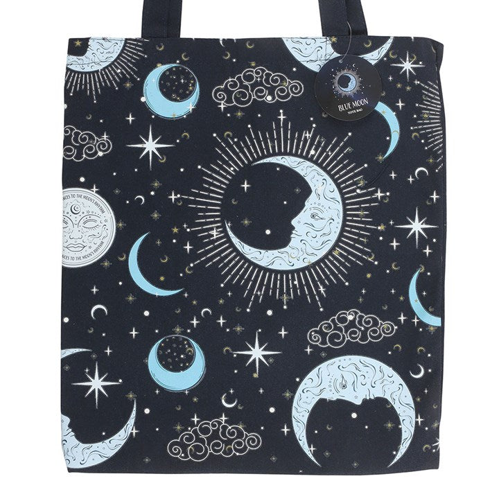 Blue Celestial Print Tote Bag in front of a white wall.