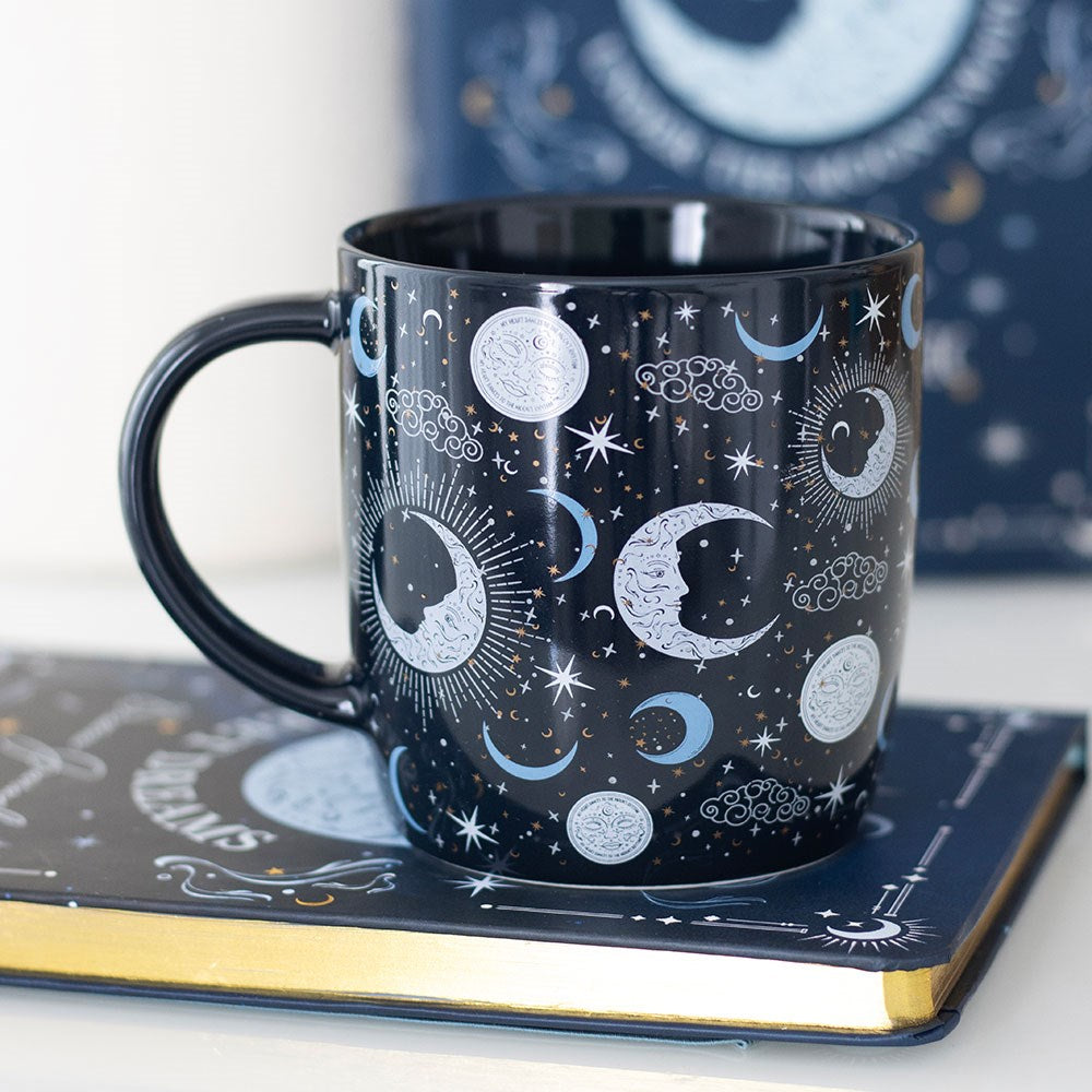 Celestial Moon and Star Mug on a book with a blue and white background