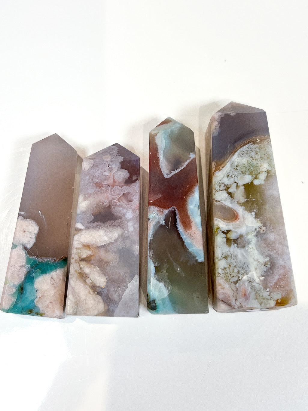 Flower Agate points on a white background.