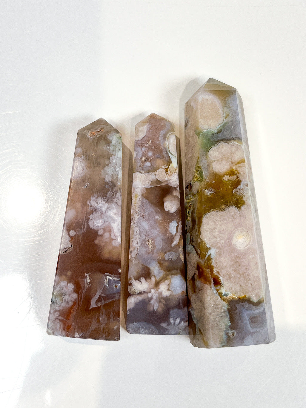 Flower Agate points on white background.