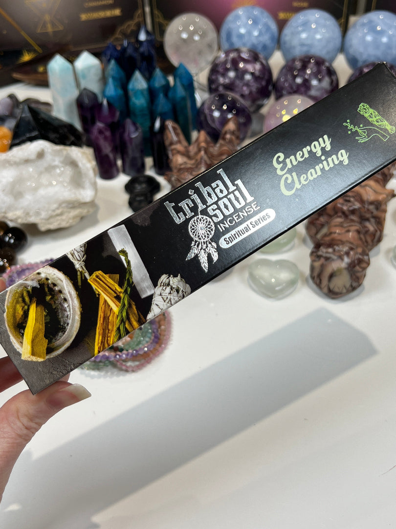 Tribal Soul incense branding held over crystals and stones.