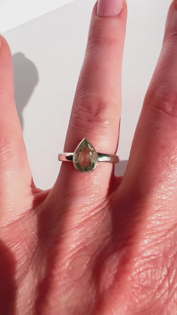 Sterling Silver Prasiolite Faceted Teardrop Ring on hand with white background.