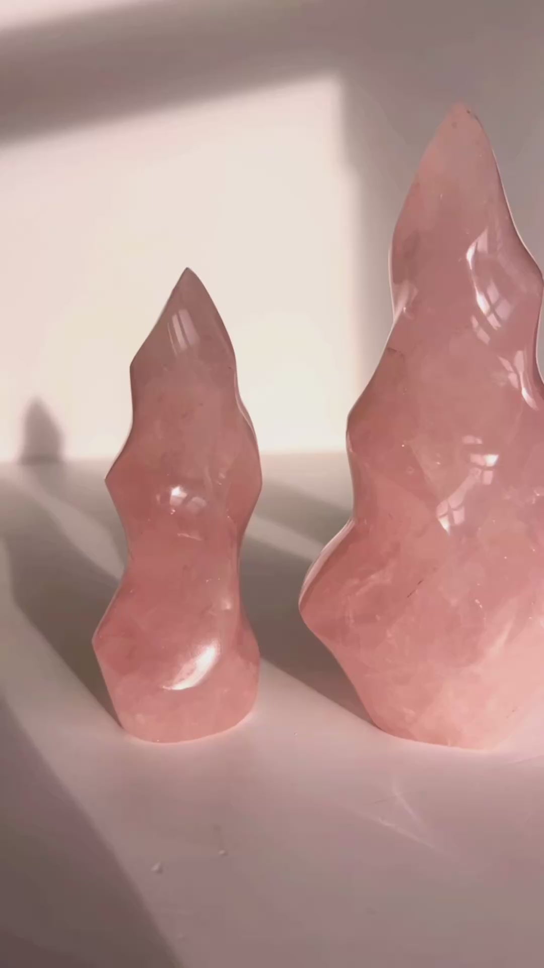 Rose Quartz Flame carving with white background.