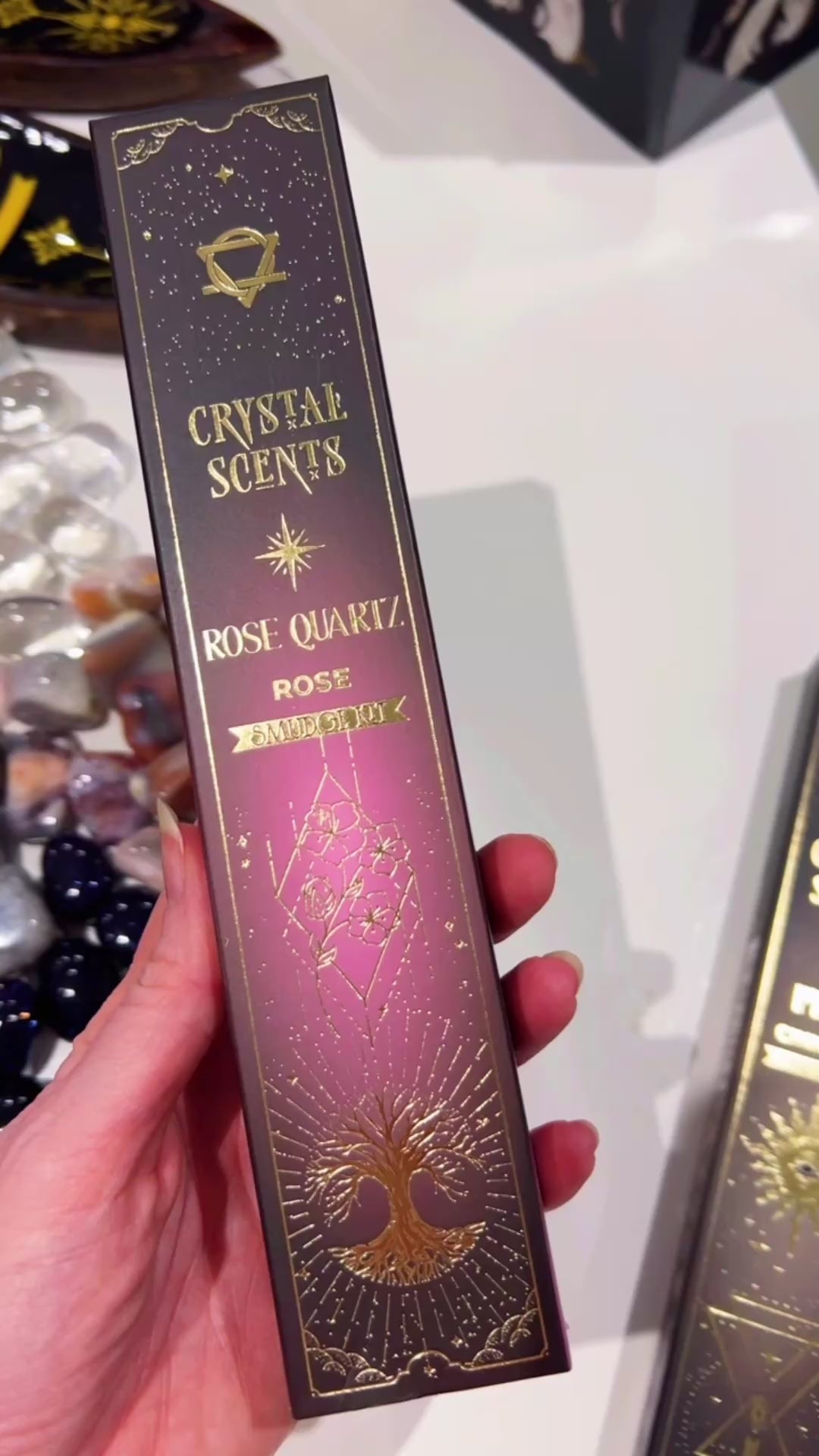 Rose Quartz Smudge Incense in hand with white background