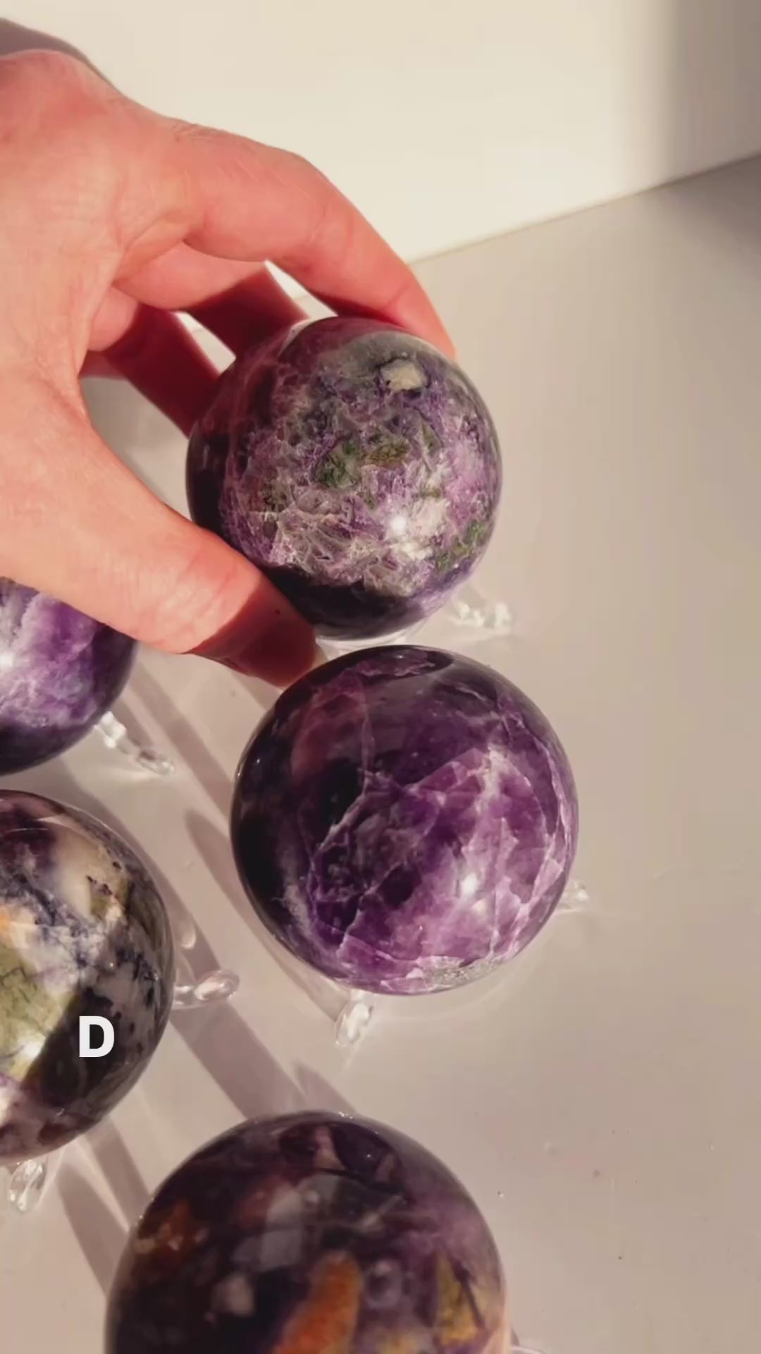 Fluorite with Jasper sphere with a white background.