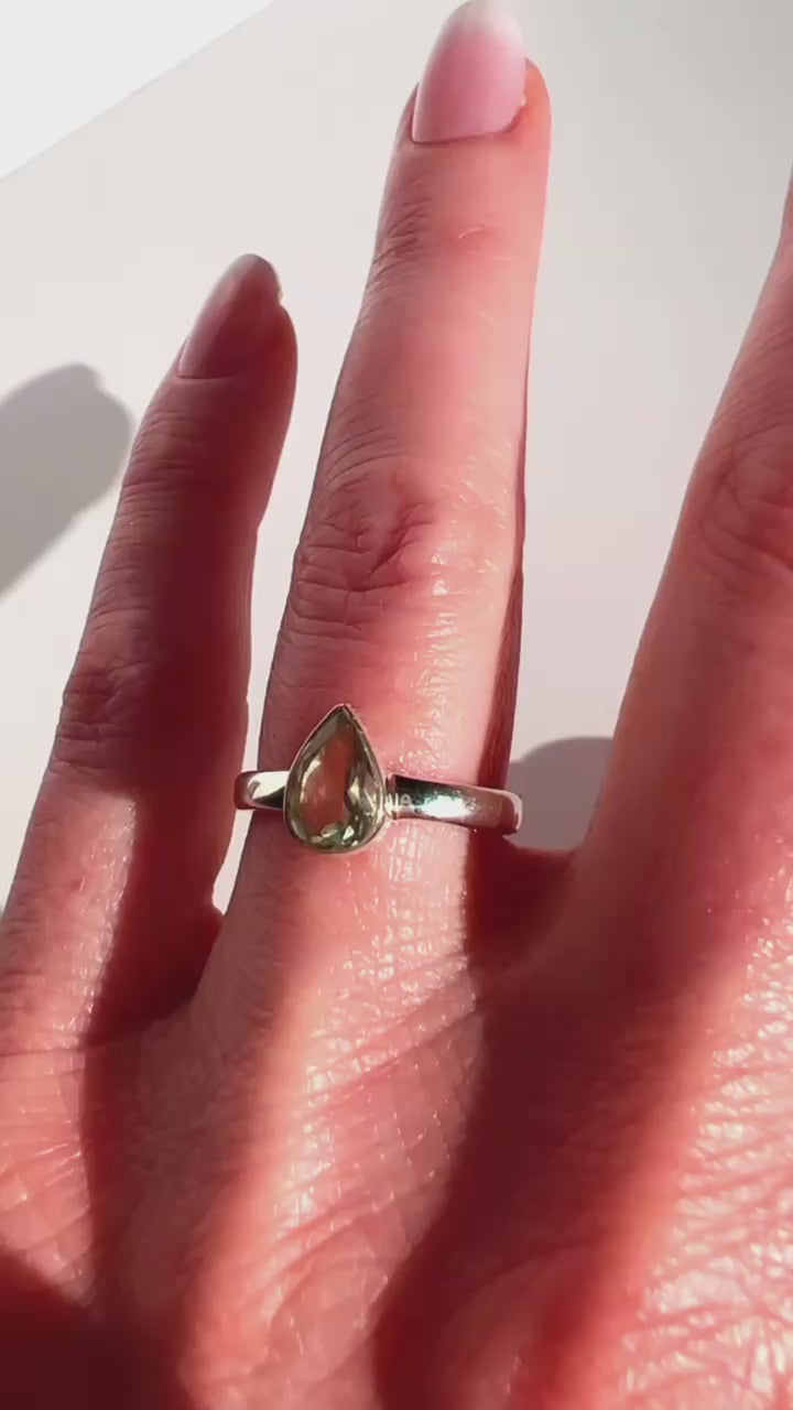 Sterling Silver Prasiolite Faceted Teardrop Ring on a hand with a white background